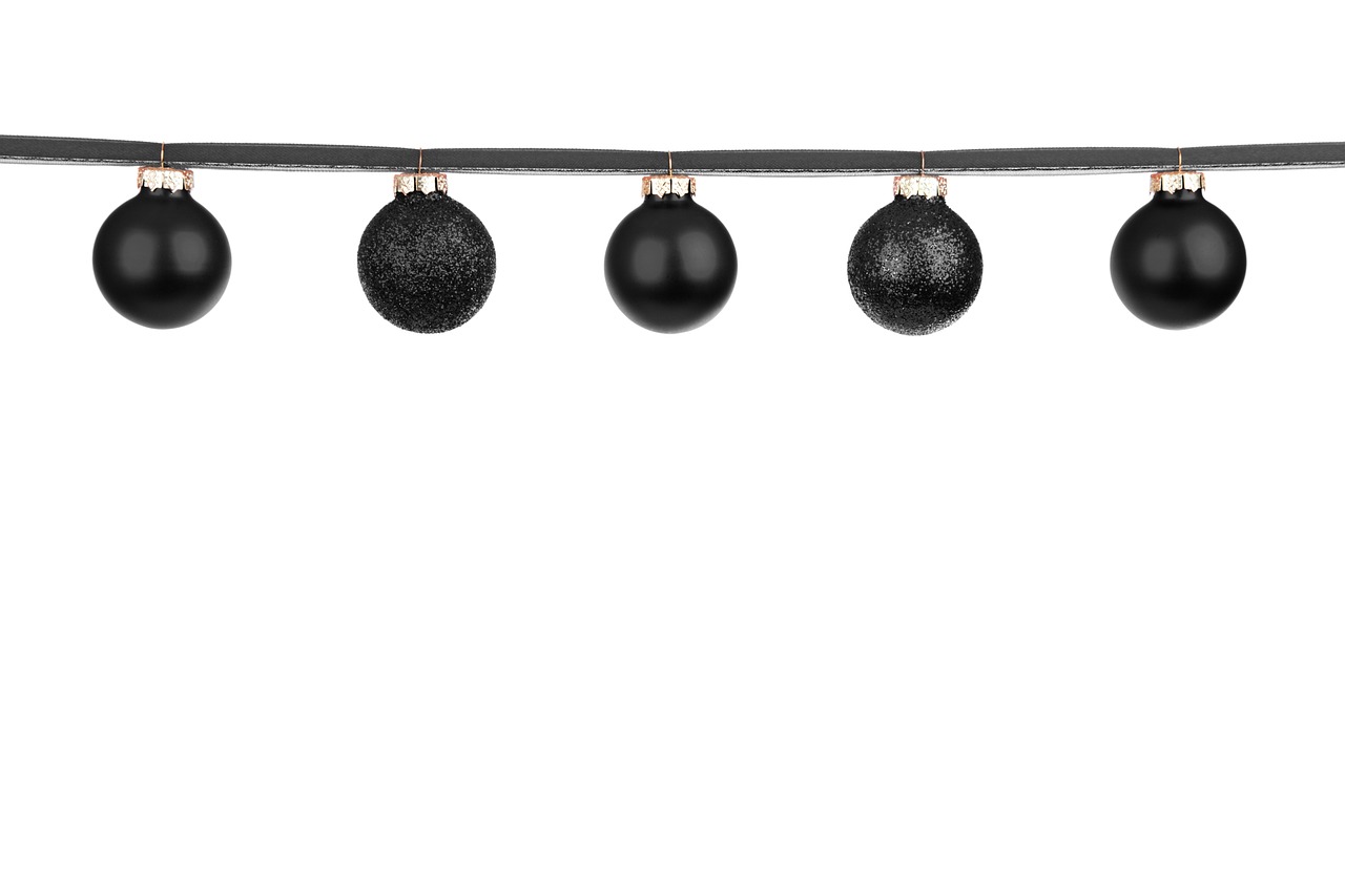 a black christmas ornament hanging from a string, shutterstock, isolated on white background, multiple lights, product photo, a black choker
