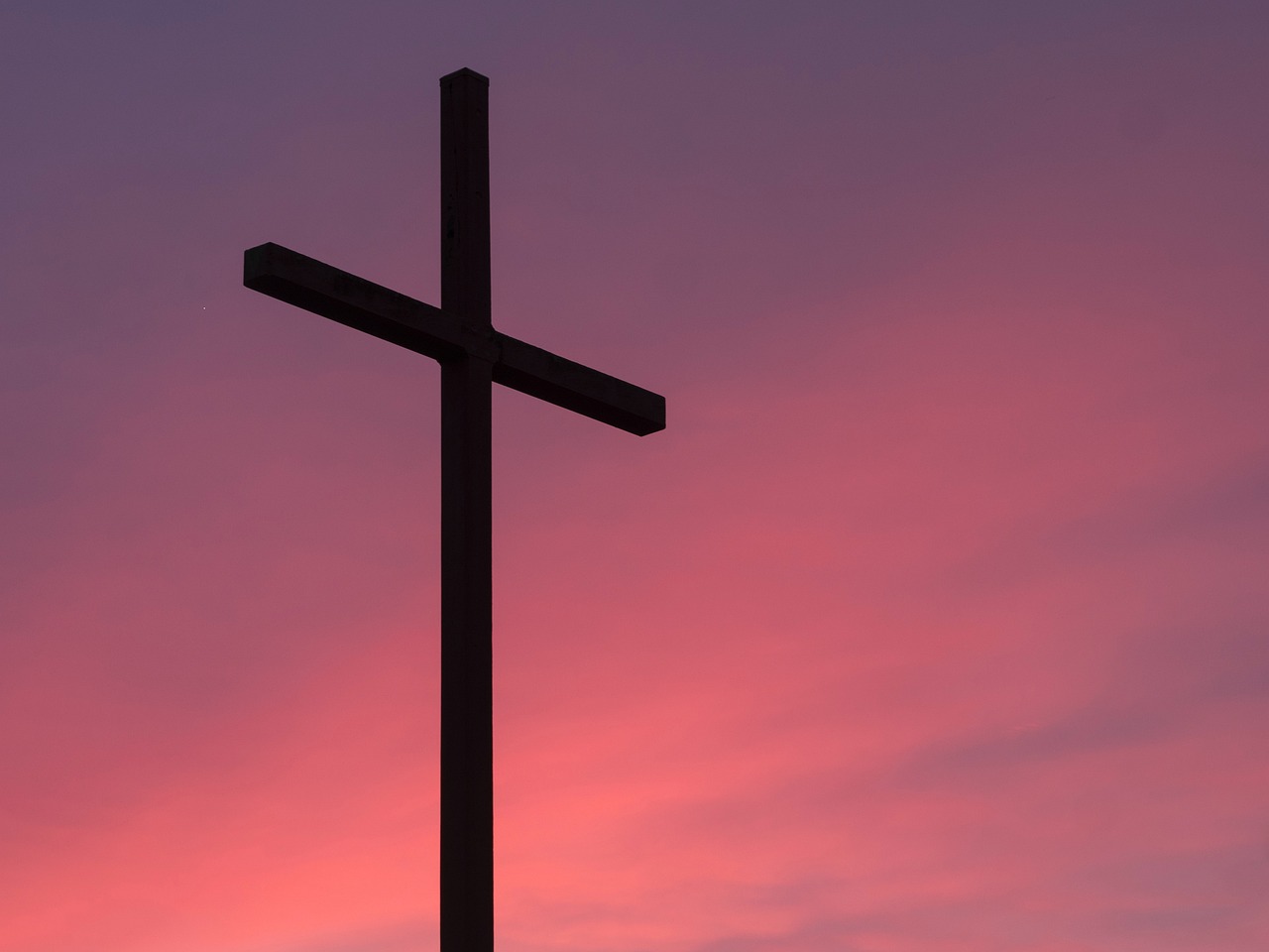 a cross on top of a hill at sunset, a picture, shutterstock, purple and red colors, full frame shot, 1128x191 resolution, stock photo