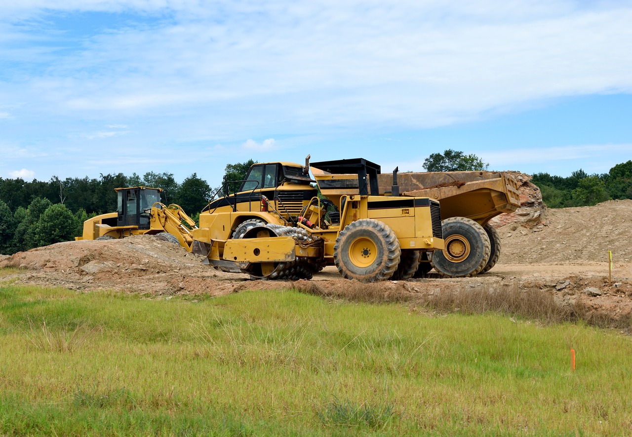 a bulldozer sitting on top of a pile of dirt, by Robert Richenburg, flickr, bottom angle, louisiana, stock photo, hi-res photo