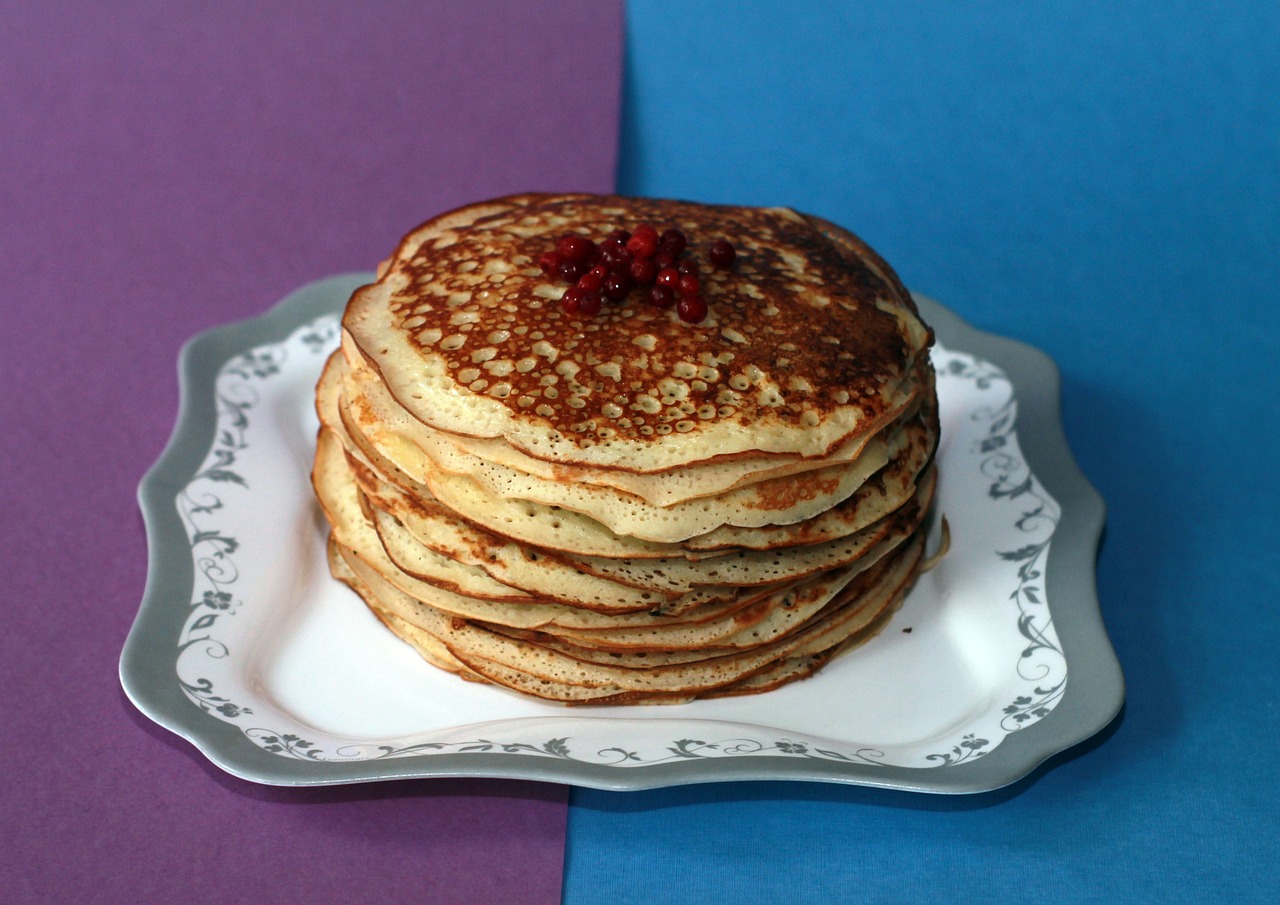 a stack of pancakes sitting on top of a white plate, inspired by Wlodzimierz Tetmajer, flickr, avangard, “berries, silver, soviet - era