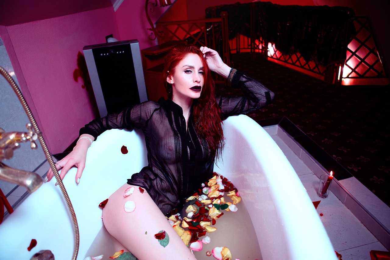 a woman that is sitting in a bath tub, inspired by Hedi Xandt, pop art, cute young redhead girl, amy adams as morticia addams, everything is made of candy, shot on webcam