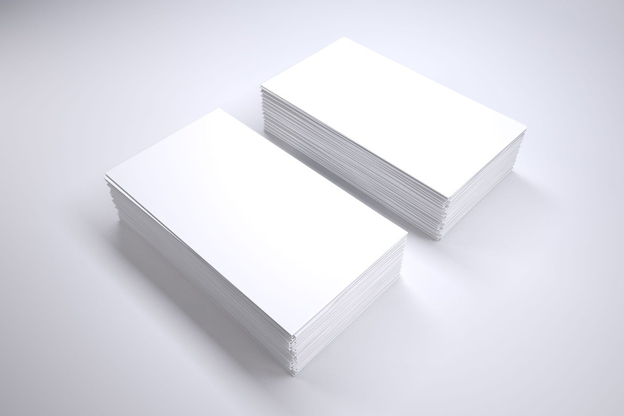 a stack of white business cards sitting on top of each other, digital art, 8 k octanerender, 4k studio photo, white sheets, mid shot photo