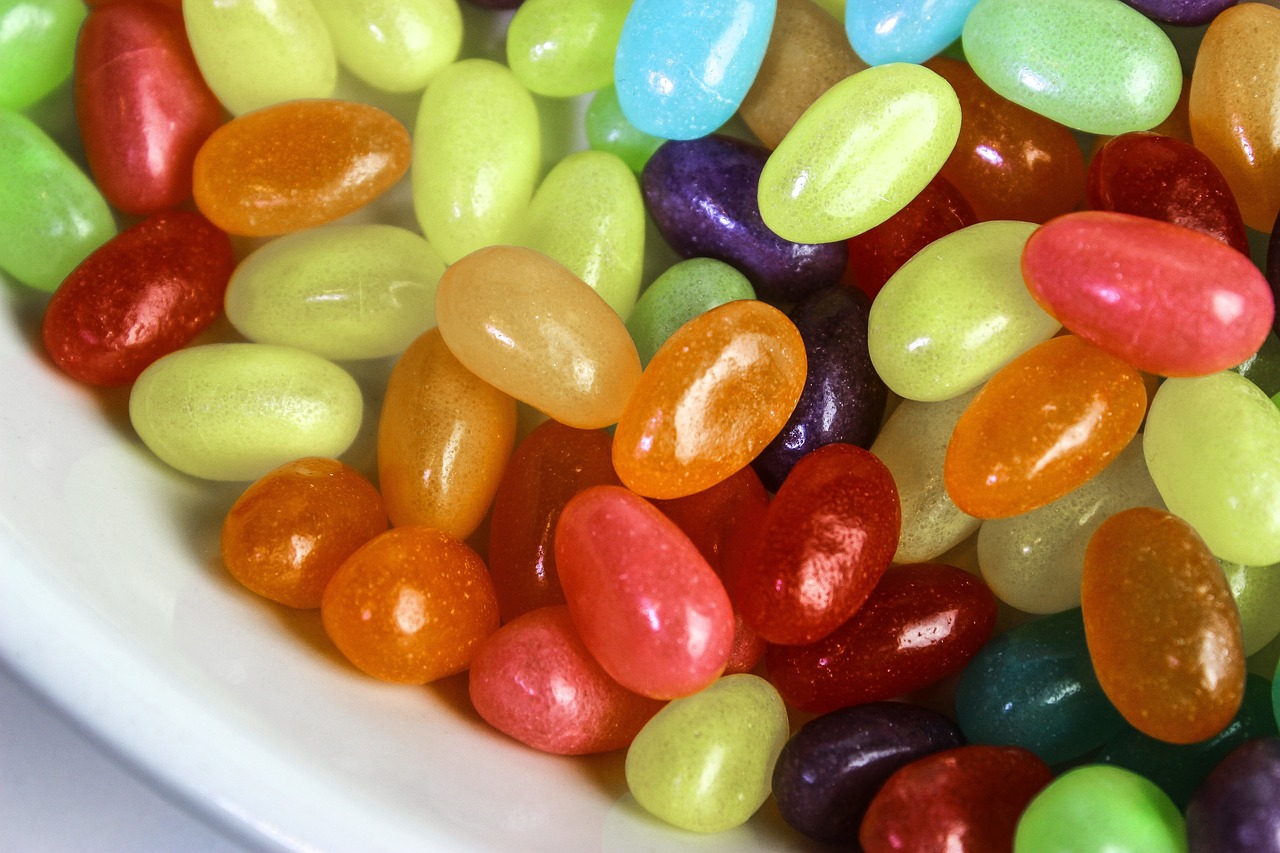 a bowl filled with jelly beans and jelly beans, by Lena Alexander, beautiful smooth oval head, candy colors, edible, skinny