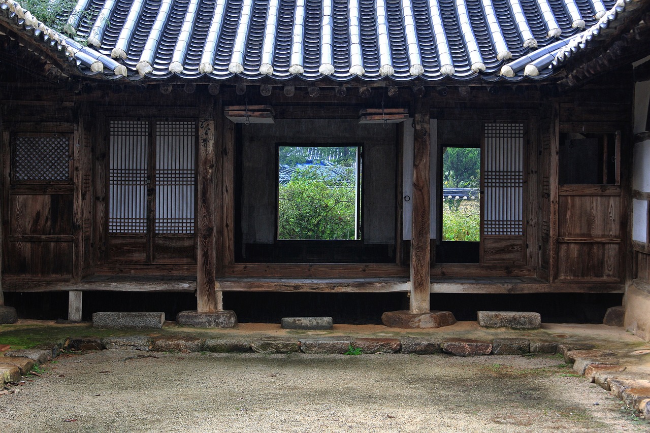 a close up of a building with a bench in front of it, a picture, inspired by Kim Hong-do, flickr, shin hanga, a wide open courtyard in an epic, -640, rural, hong soonsang