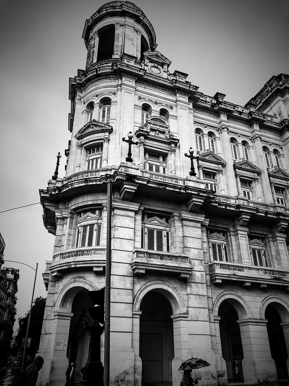 a black and white photo of an old building, by Xavier Blum Pinto, unsplash, cuban revolution, marble!! (eos 5ds r, victorian buildings, multistory building