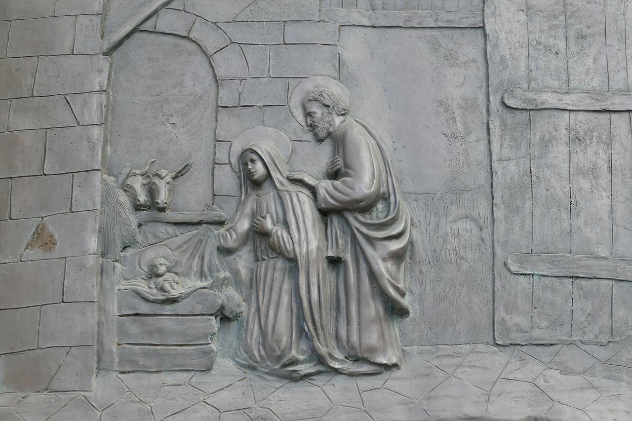 a statue of a man kneeling next to a woman, by Cagnaccio di San Pietro, trending on pixabay, fine art, epiphany, bas relief, with infant jesus, stanisław szukalski