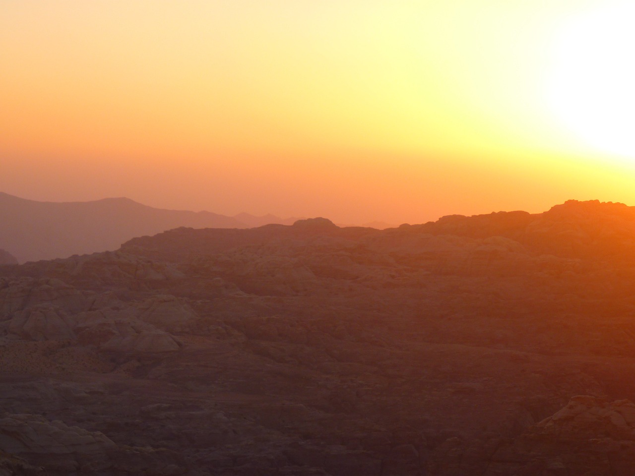 a person riding a horse on top of a mountain, hurufiyya, the glimmering orange dawn, banner, july 2 0 1 1, desert photography