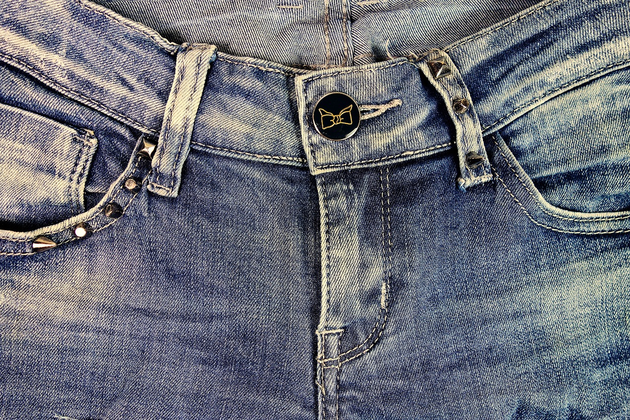 a close up of a pair of blue jeans, by Niko Henrichon, happening, bellybutton, taken on iphone 1 3 pro, hdr detail, extreme detail photo quality
