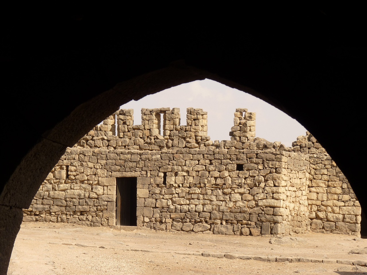 a stone building sitting in the middle of a desert, dau-al-set, view from inside, detail, fortress gateway, random detail