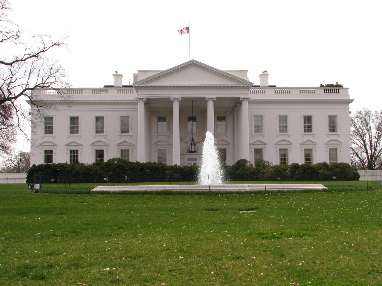 a white house with a fountain in front of it, by Ken Elias, flickr, from 2001, april, ground-level view, white wearing
