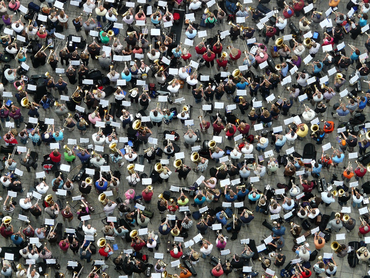 a large group of people playing musical instruments, a photo, by Erwin Bowien, shutterstock, high aerial shot, ap photo, munich, afp