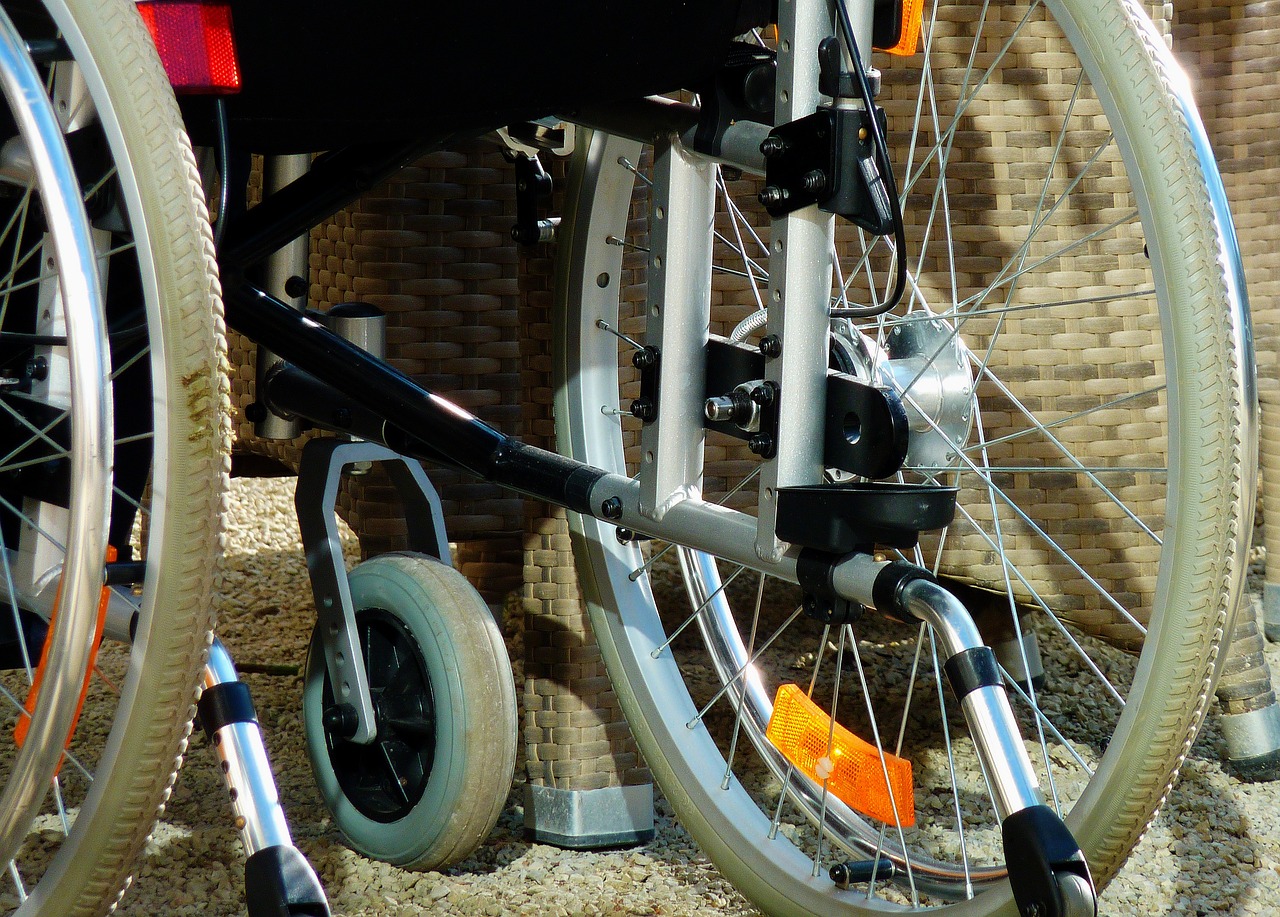 a close up of a wheel on a bike, by Thomas Häfner, figuration libre, accessible for the disabled, medical equipment, warm sunshine, photo-realistic maximum detail