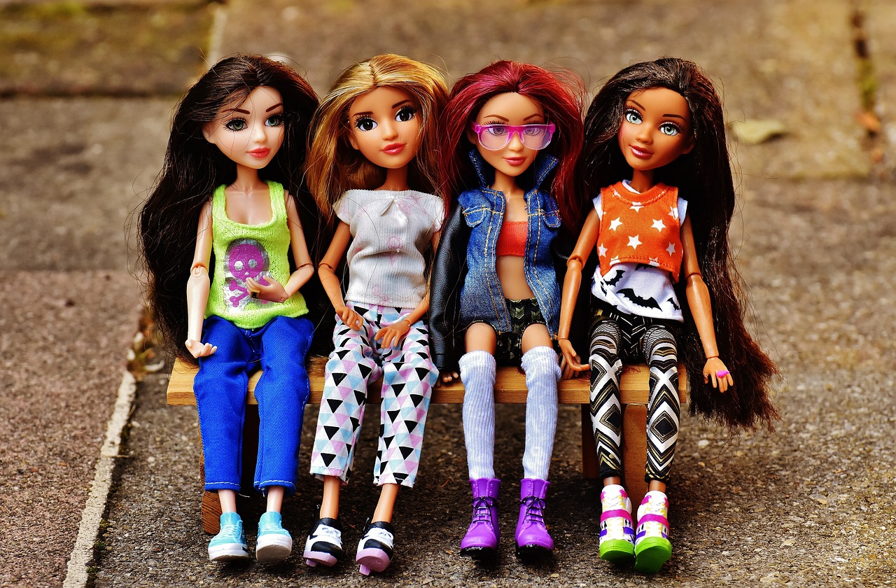 a group of dolls sitting on top of a wooden bench, a picture, by mckadesinsanity, pexels, toyism, wearing jeans, teen titans, high school girls, mattel