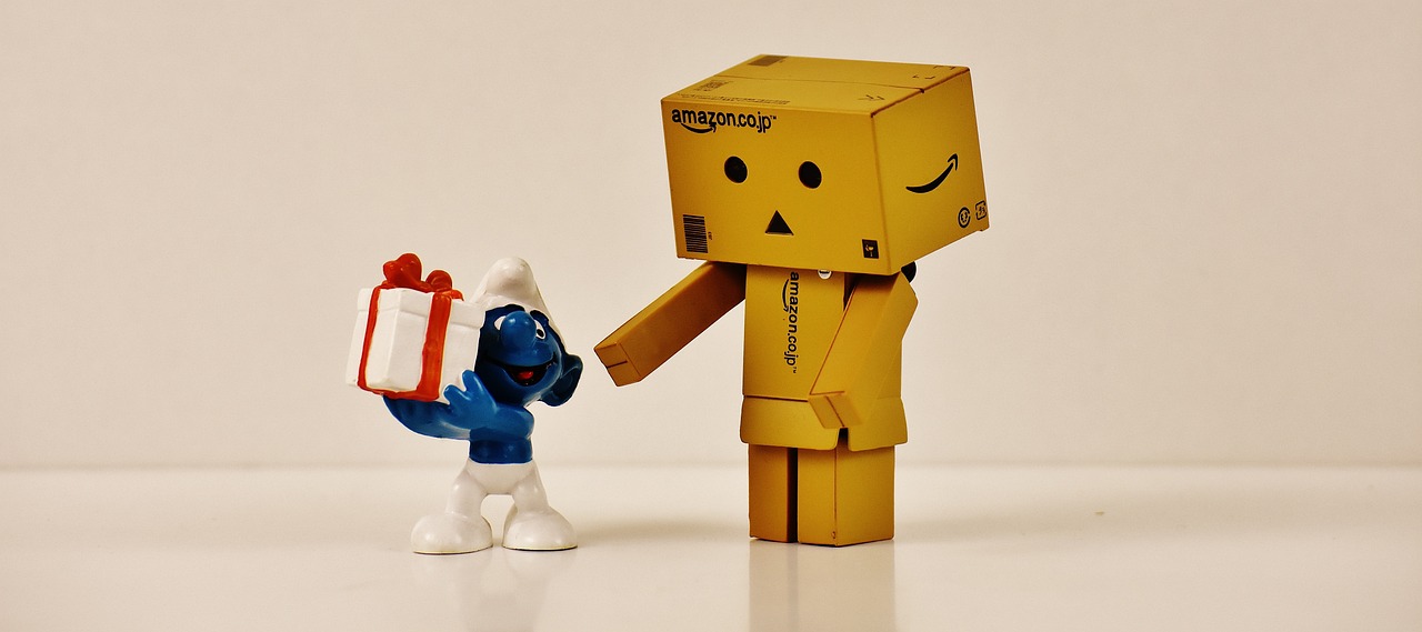 a couple of figurines standing next to each other, by Sam Havadtoy, reddit contest winner, minimalism, delivering packages for amazon, adorable friendly robot, blue and gold, poyo