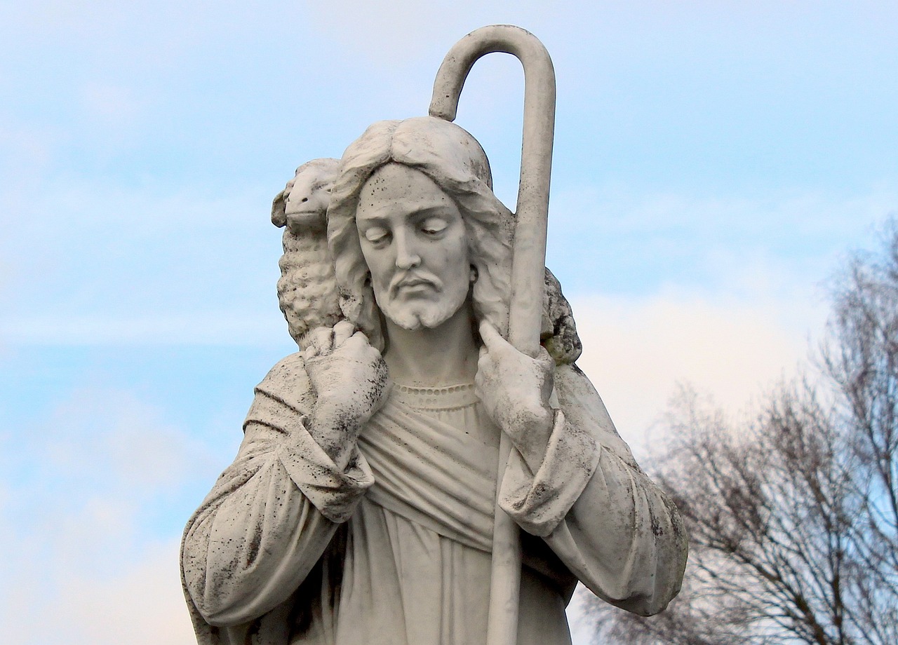 a statue of jesus holding a sheep and a staff, by Alexander Scott, flickr, attractive pagan male deity, looking straight ahead, snake, god of winter