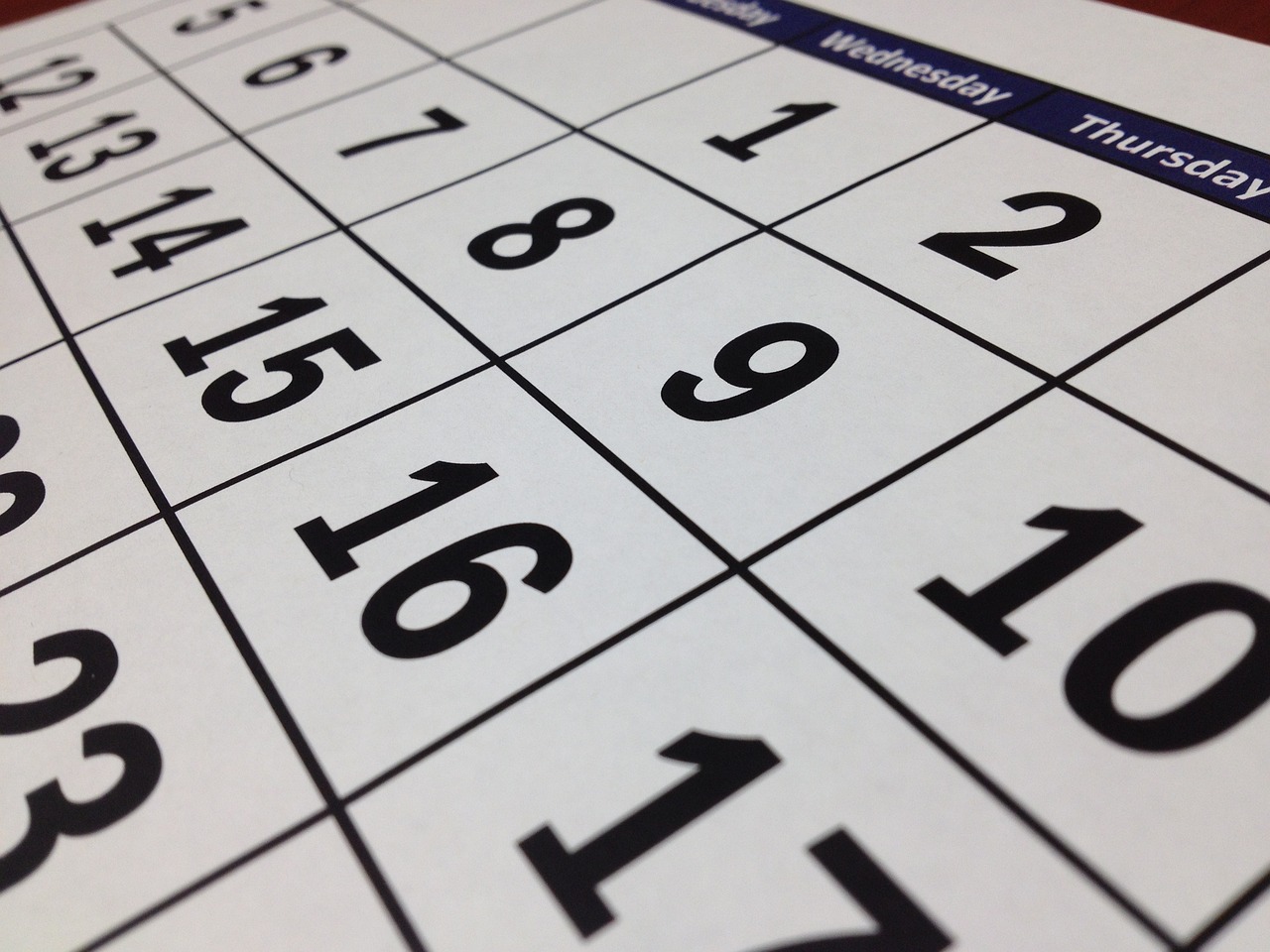 a close up of a calendar on a table, by Andrei Kolkoutine, happening, ready to model, detailed grid as background, very consistent, photo taken in 2018
