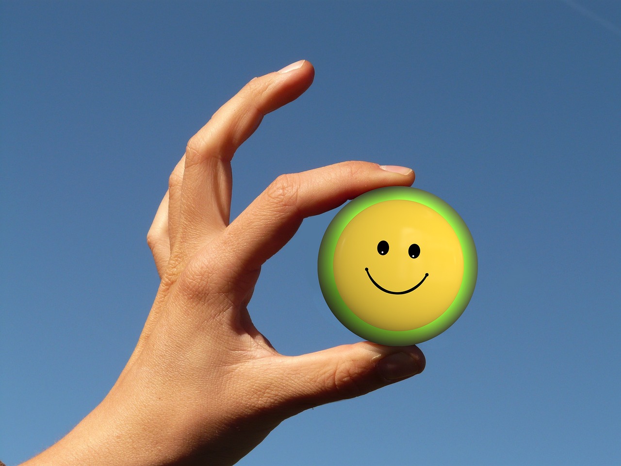 a person holding a smiley face ball in their hand, a picture, by Jan Rustem, precisionism, cad, very very happy!, a green, everyday plain object