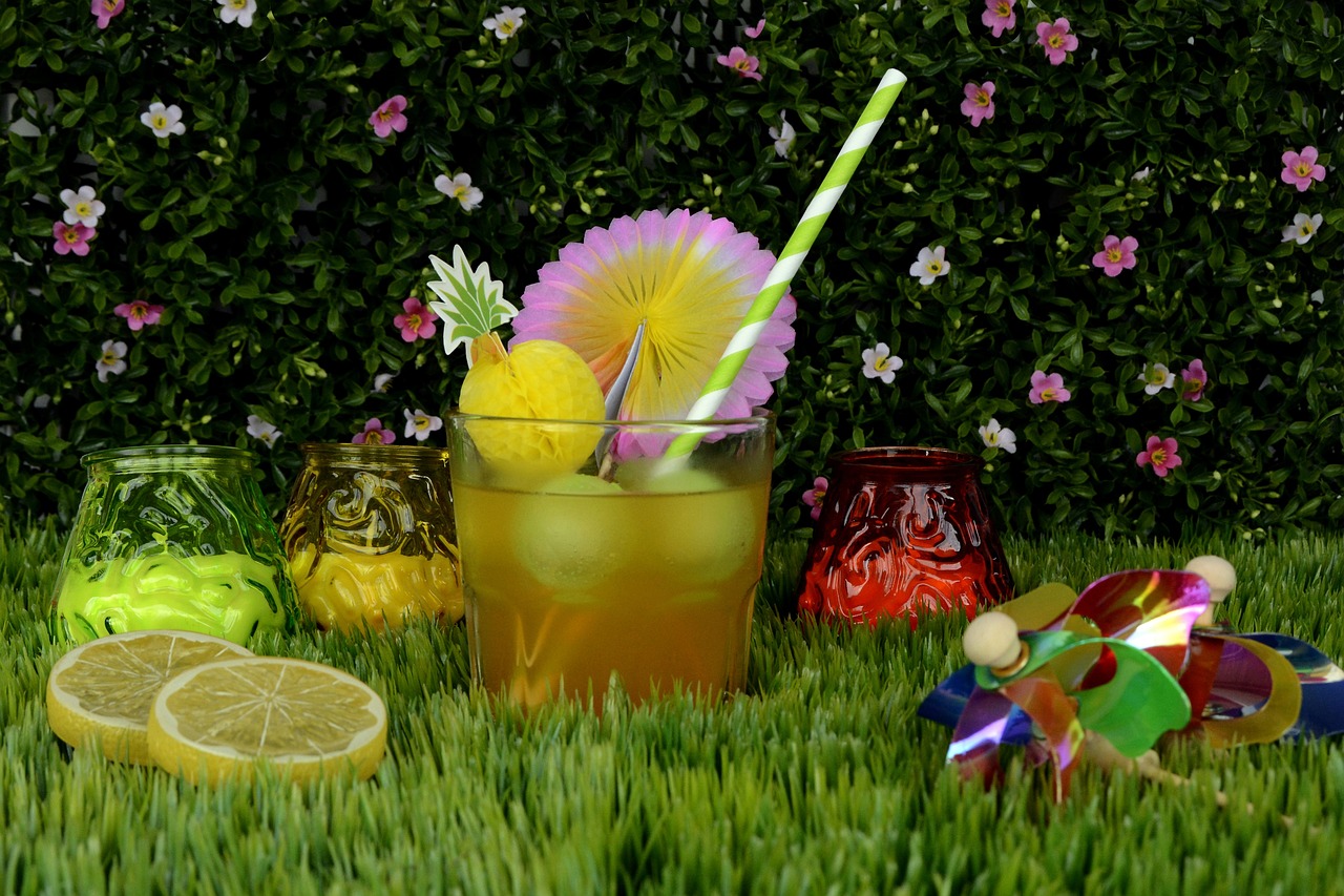 a drink sitting on top of a lush green field, fully decorated, professional product photo, yard, tropical setting