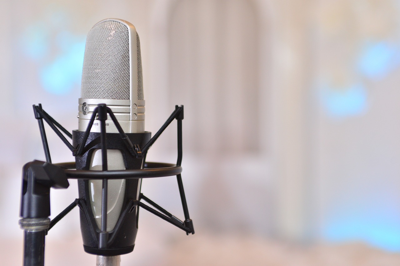 a close up of a microphone with a blurry background, an album cover, by Juan O'Gorman, shutterstock, inside a grand studio, stockphoto, gauze, vocal tract model