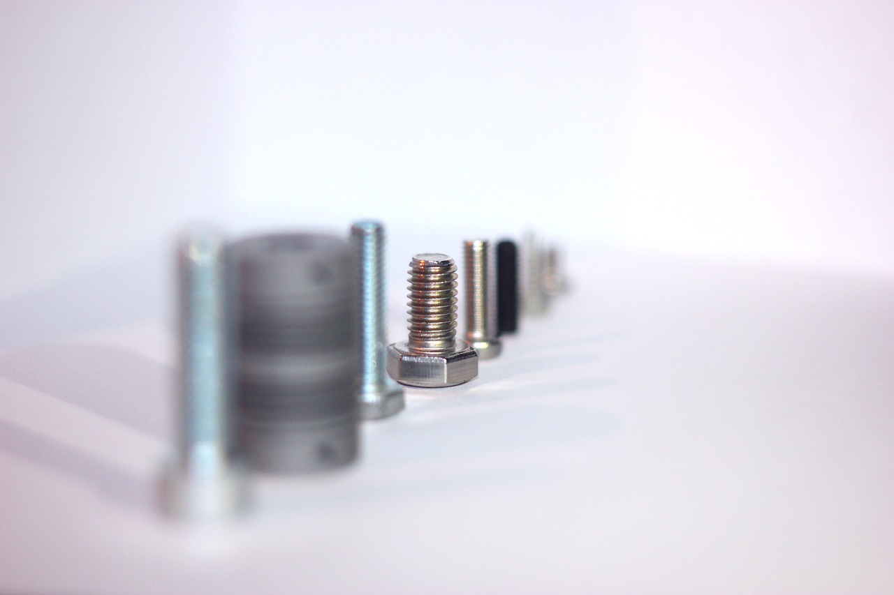 a row of screws sitting on top of a table, a tilt shift photo, highly detailed product photo, electrical appendages, product introduction photo, various items