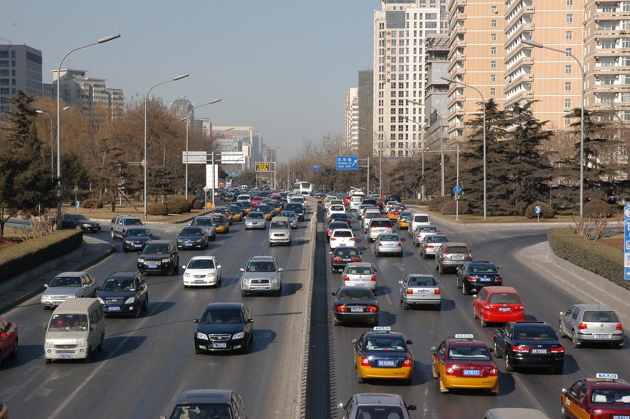 a street filled with lots of traffic next to tall buildings, by Yi Jaegwan, flickr, happening, baotou china, many exotic cars, [ [ hyperrealistic ] ], sweltering