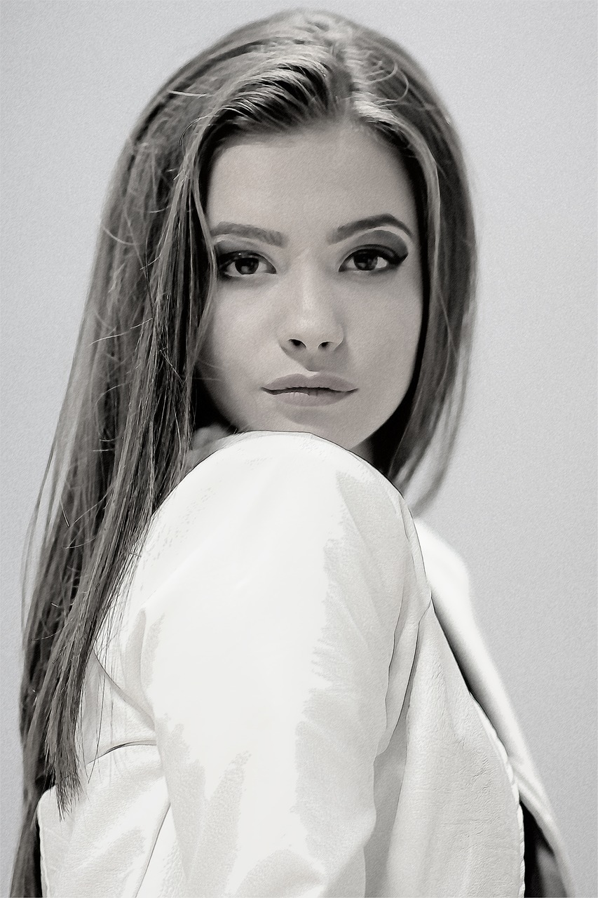 a black and white photo of a woman with long hair, inspired by Ksenia Milicevic, white sleeves, isabela moner, color studio portrait, mila kunis