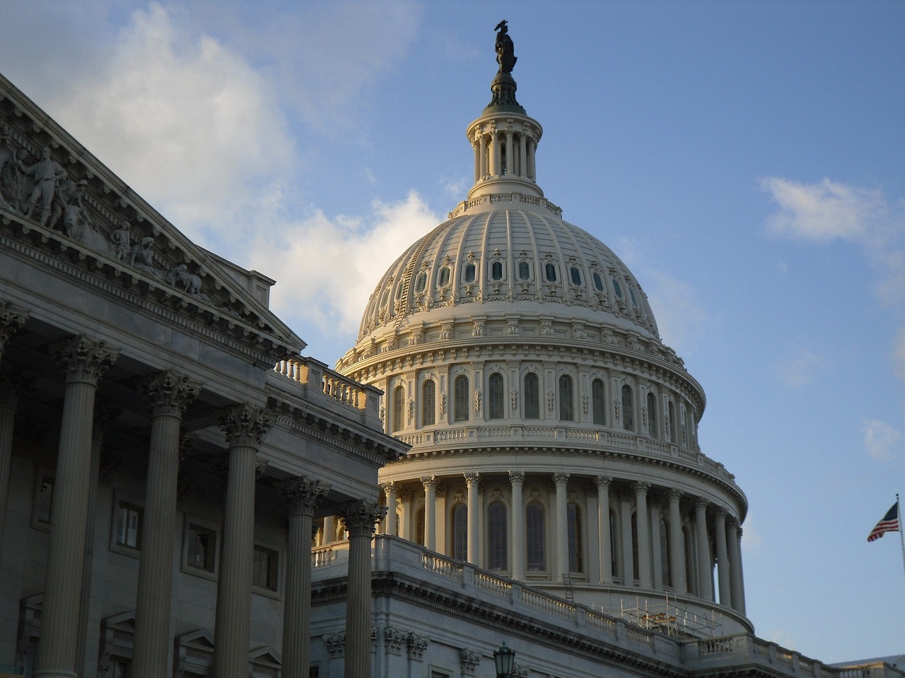 the dome of the u s capitol building against a blue sky, a photo, by Tom Carapic, flickr, futuristic government chambers, deck, compressed jpeg, side