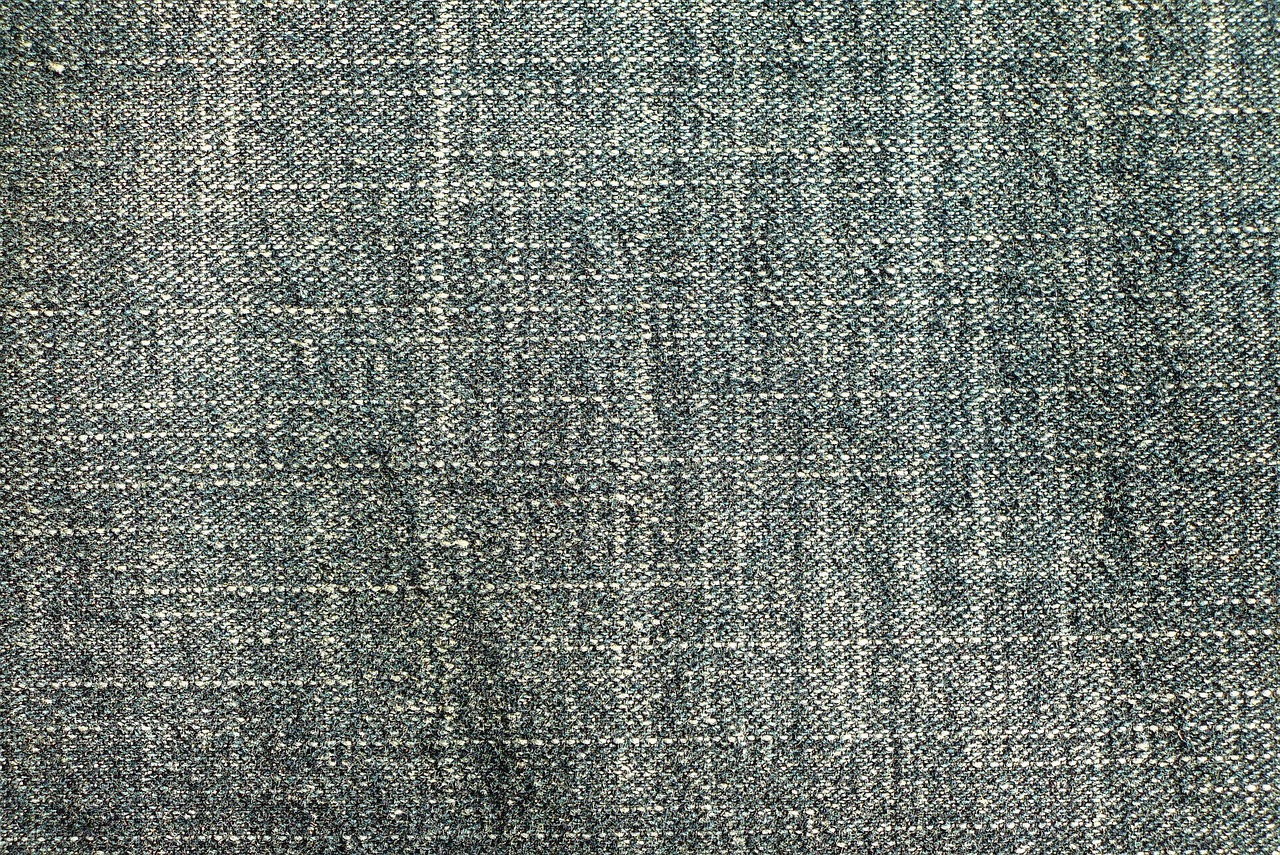 a close up of a piece of fabric, a stock photo, iphone background, very sharp and detailed image, denim jeans, greenish blue tones