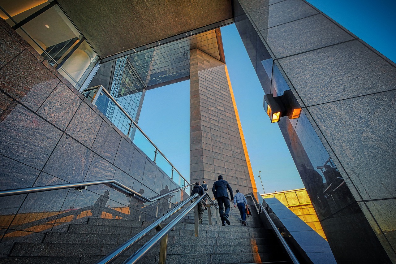 a group of people walking up a flight of stairs, by Mathias Kollros, flickr, modernism, elegant walkways between towers, hdr detail, at sunrise, opposite the lift-shaft