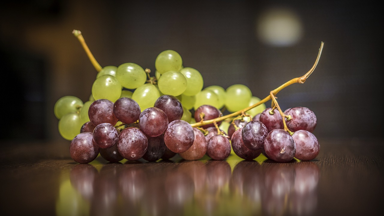 a bunch of grapes sitting on top of a table, a picture, by Julian Hatton, 4k detail post processing, high quality product image”