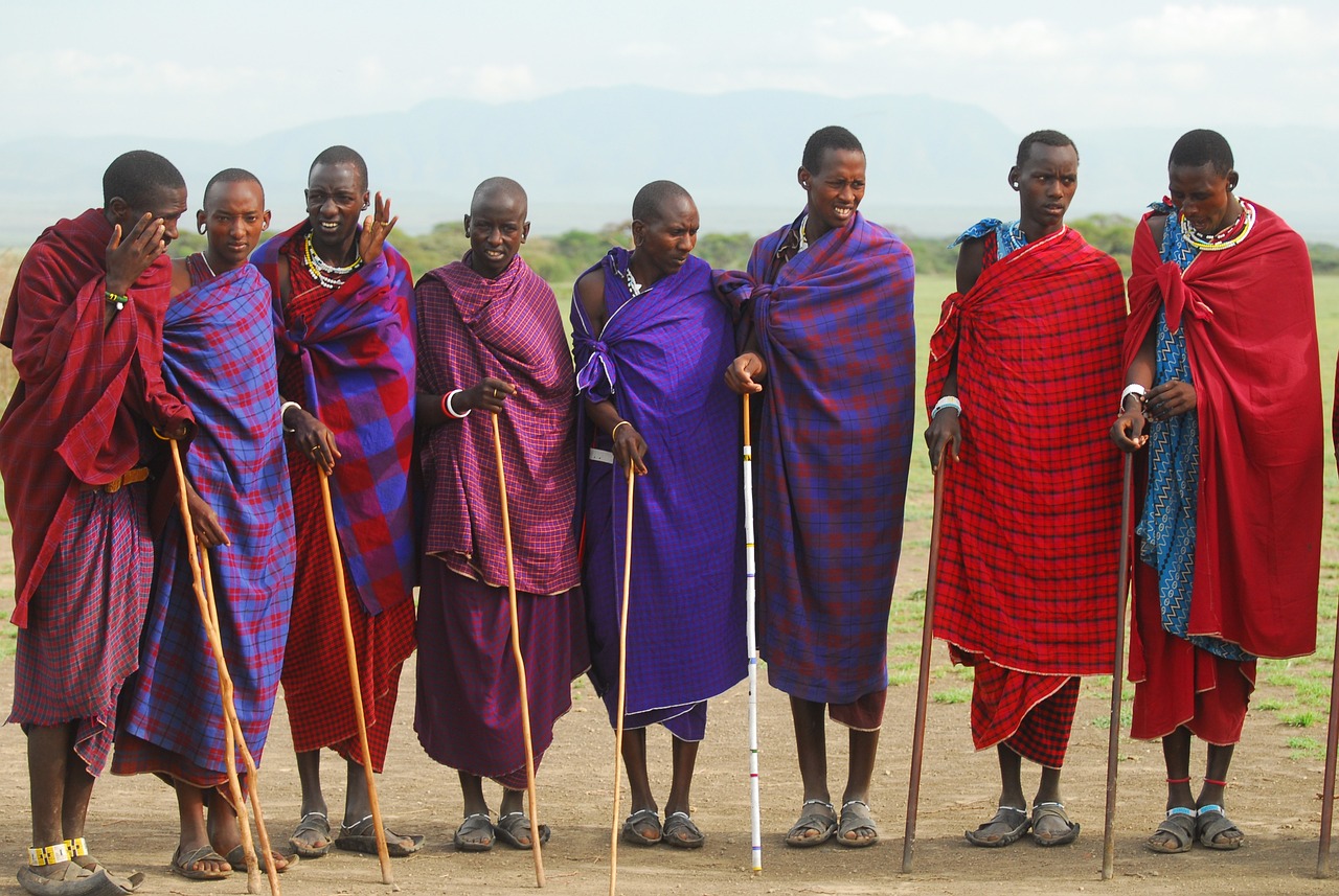 a group of men standing next to each other, by Dietmar Damerau, trending on pixabay, hurufiyya, masai, purple robes, crutches, 🦩🪐🐞👩🏻🦳