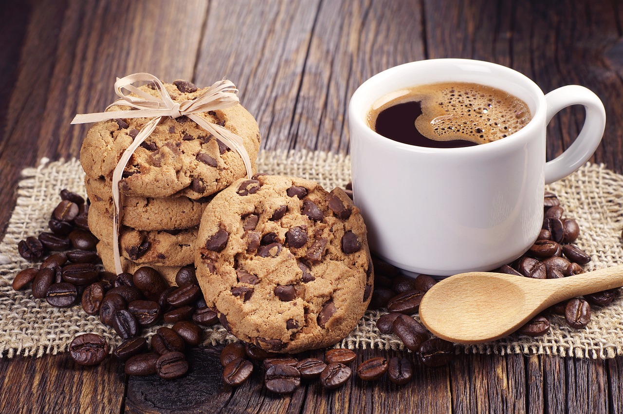 two cookies and a cup of coffee on a table, shutterstock, coffee beans, 4262862863, cookies, wallpaper - 1 0 2 4