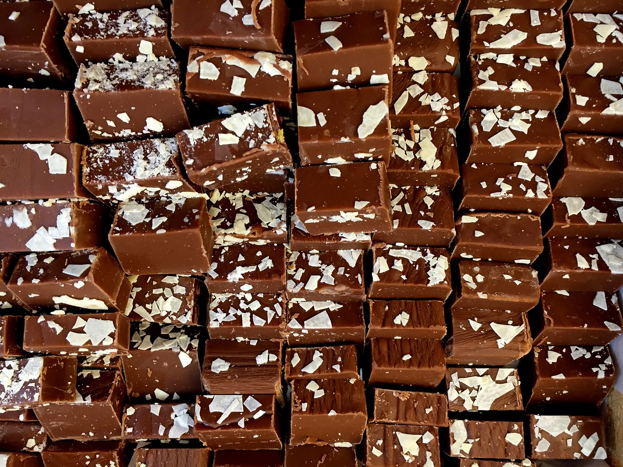 a pile of pieces of chocolate sitting on top of each other, by Samuel Scott, detiled, melbourne, lush, salt