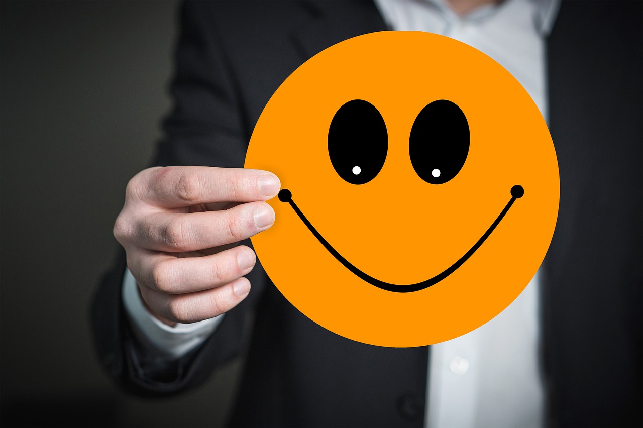 a close up of a person holding a smiley face, a picture, figuration libre, 😃😀😄☺🙃😉😗, optimism, blog-photo, ad image