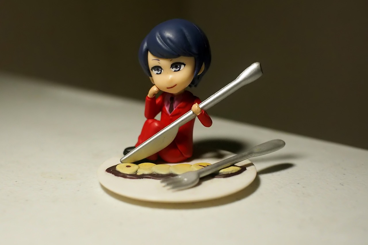 a figurine of a woman holding a knife and fork, a picture, flickr, shin hanga, miraculous ladybug, !!posing_as_last_supper, flat pancake head, taken with sigma 2 0 mm f 1. 4