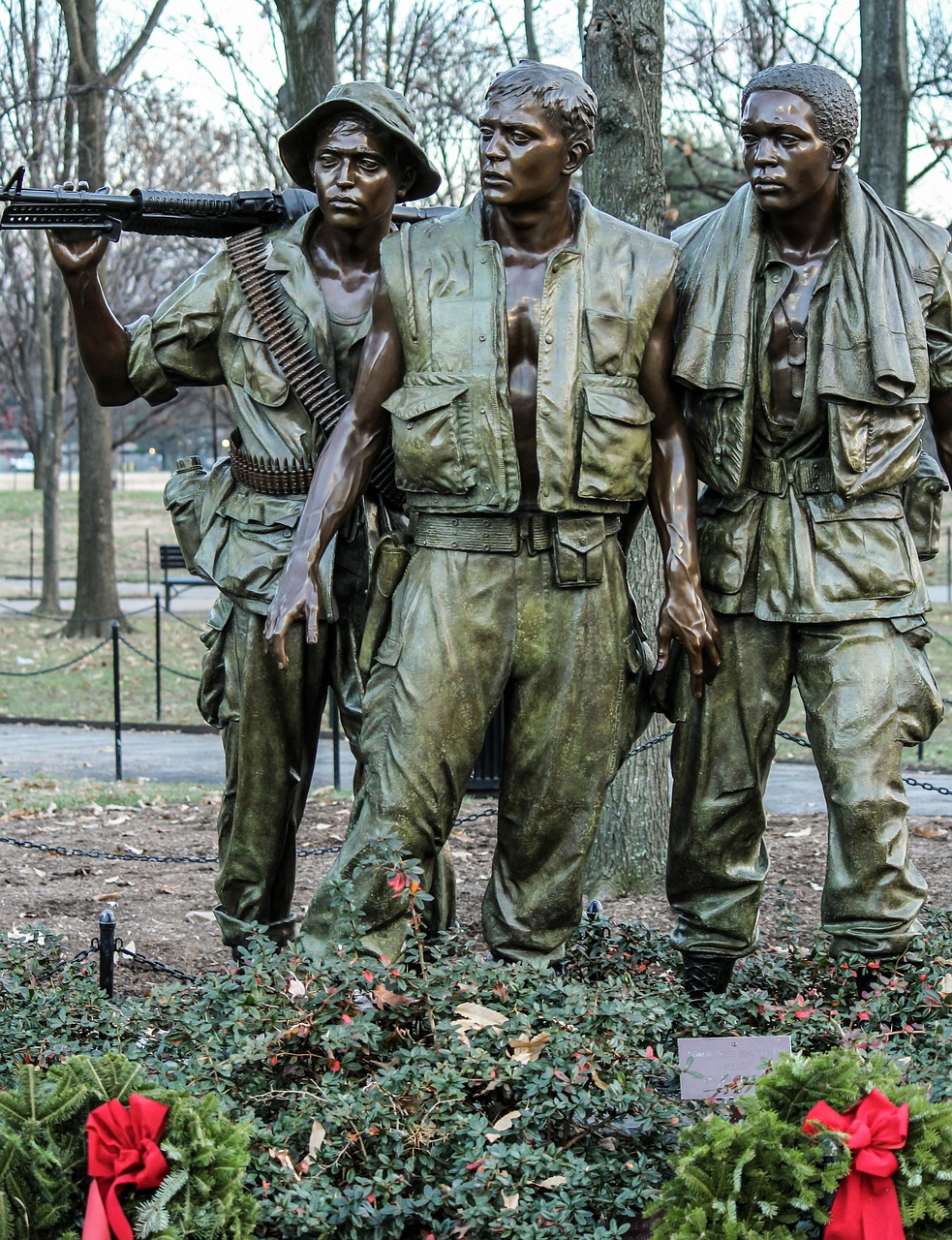 a statue of three soldiers standing next to each other, by Robert M. Cunningham, iconic shot, full detail, blood and dead soldiers, posing for the camera