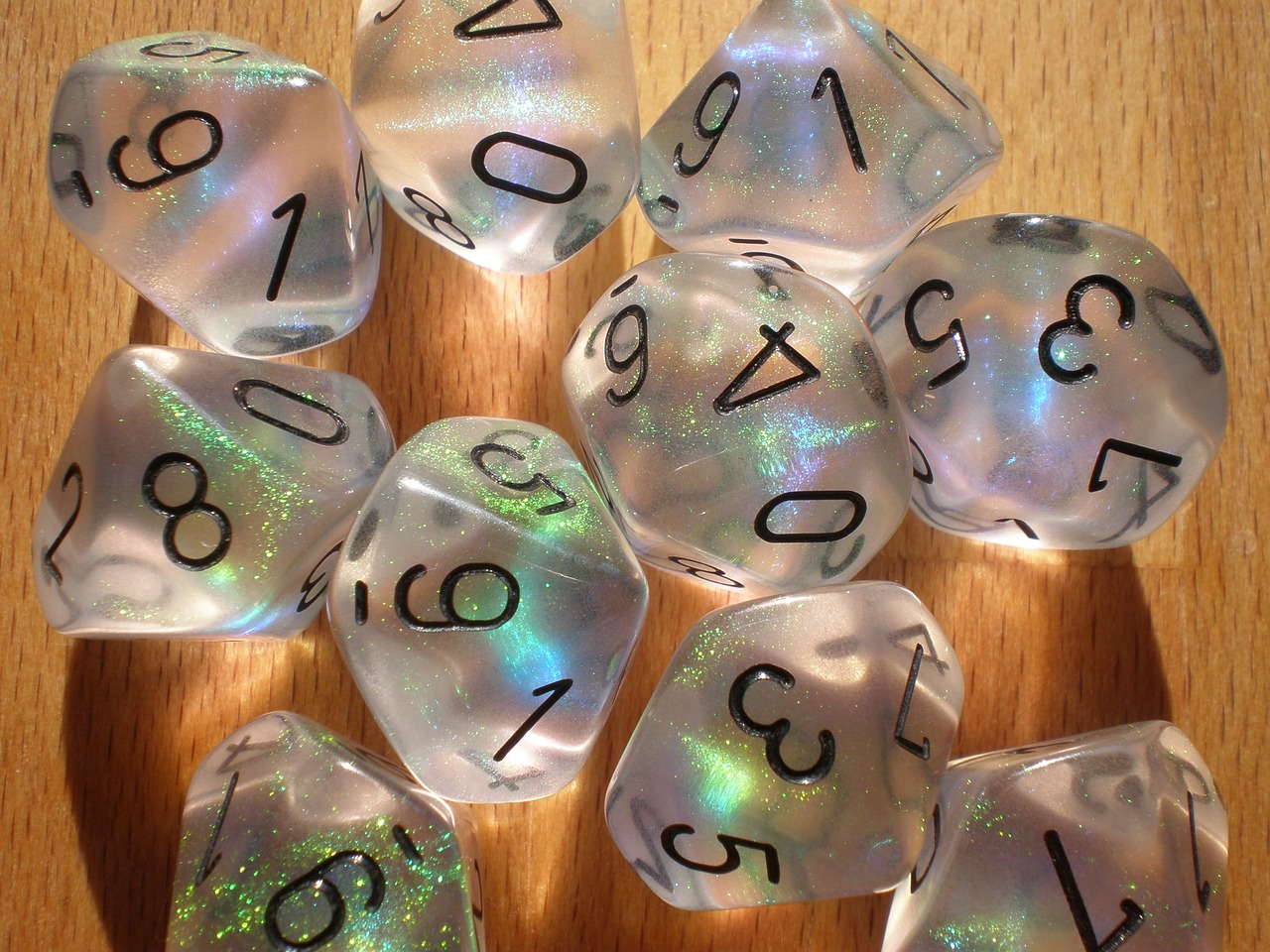 a pile of translucent dice sitting on top of a wooden table, by Dave Allsop, tumblr, holography, sacred numbers, white sparkles everywhere, dials, heat shimmering