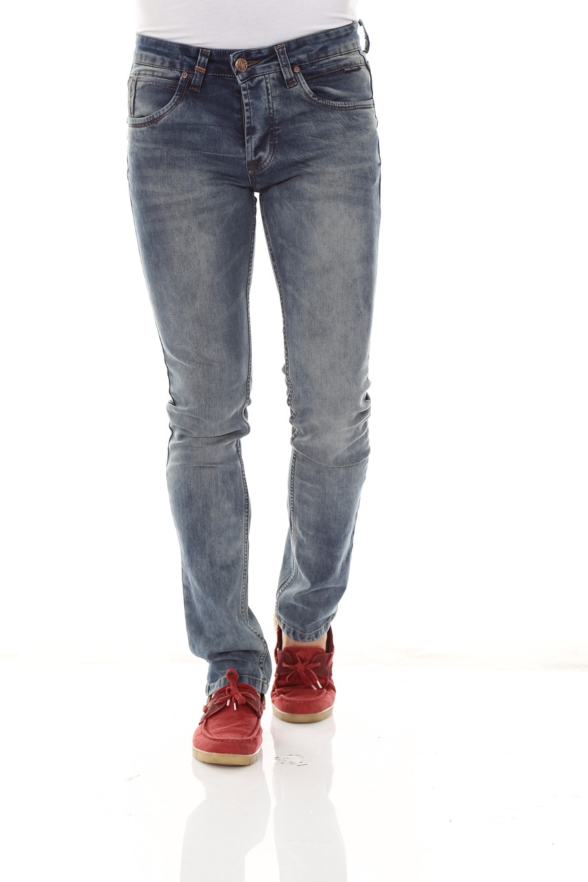 a woman standing with her hands in her pockets, by John Luke, realism, tight blue jeans and cool shoes, male model, high detail product photo, full - body - front - shot