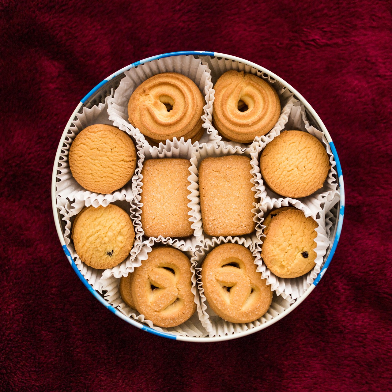 a blue and white bowl filled with assorted cookies, a stock photo, dau-al-set, symmetric!!, rondel, miniature product photo, reddish