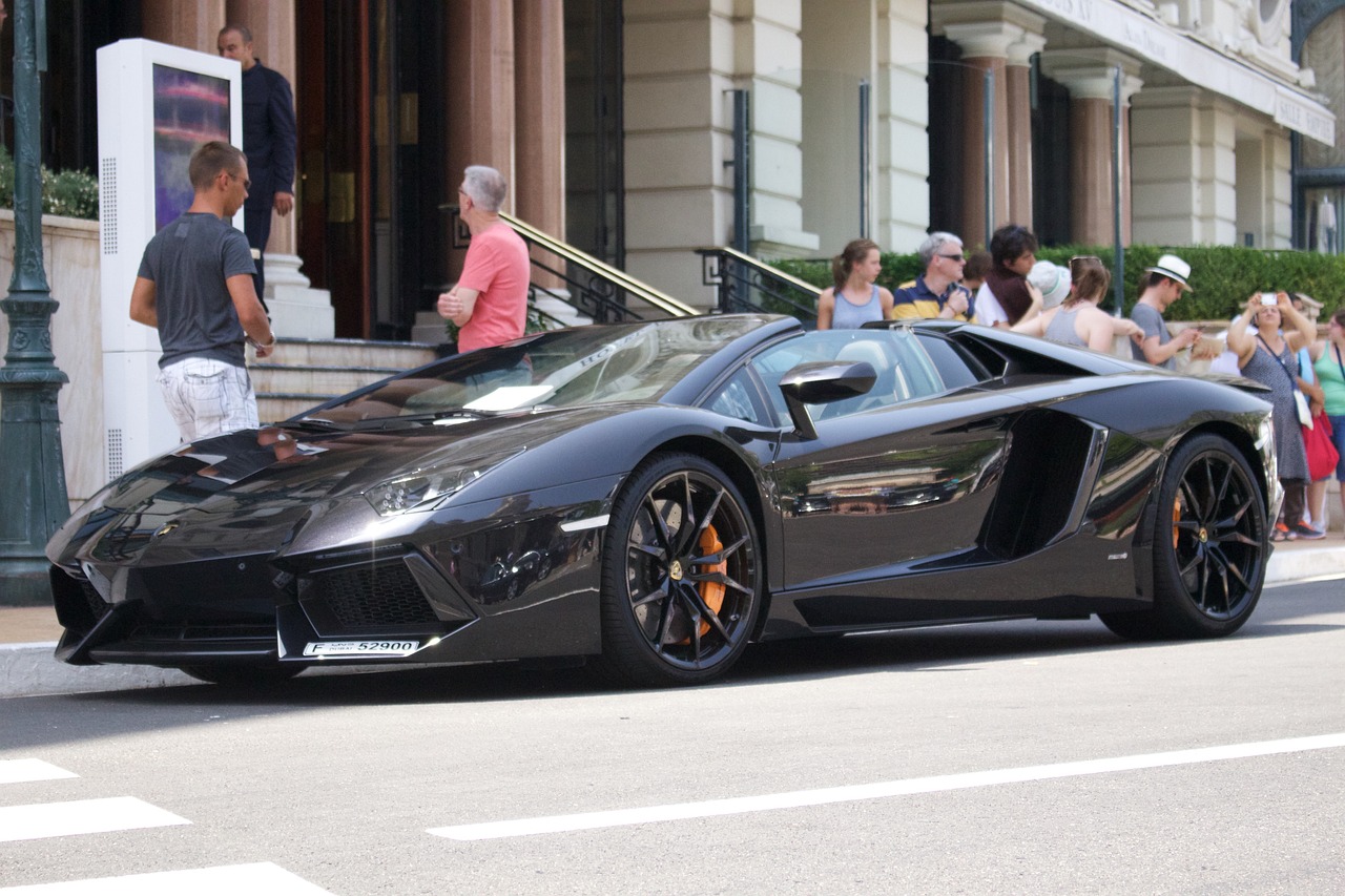 a black sports car parked on the side of the road, a picture, tumblr, veneno, chicago, australian, very very very rich