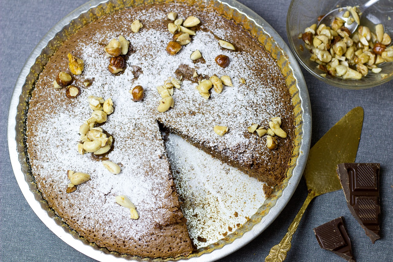 a pie with a slice taken out of it, inspired by Louise Abbéma, beiges, nuttavut baiphowongse, chocolate, bronze poli