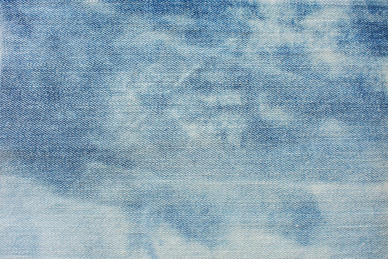 a close up of a piece of fabric with a sky background, a stock photo, inspired by Saitō Kiyoshi, pexels, tight denim jeans, watercolor-wash, hq 4k phone wallpaper, on white background