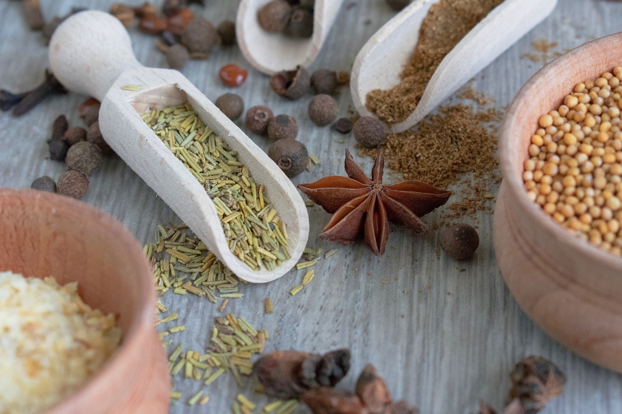 a table topped with wooden spoons filled with spices, inspired by Géza Dósa, close-up product photo, macro image, star, delightful surroundings