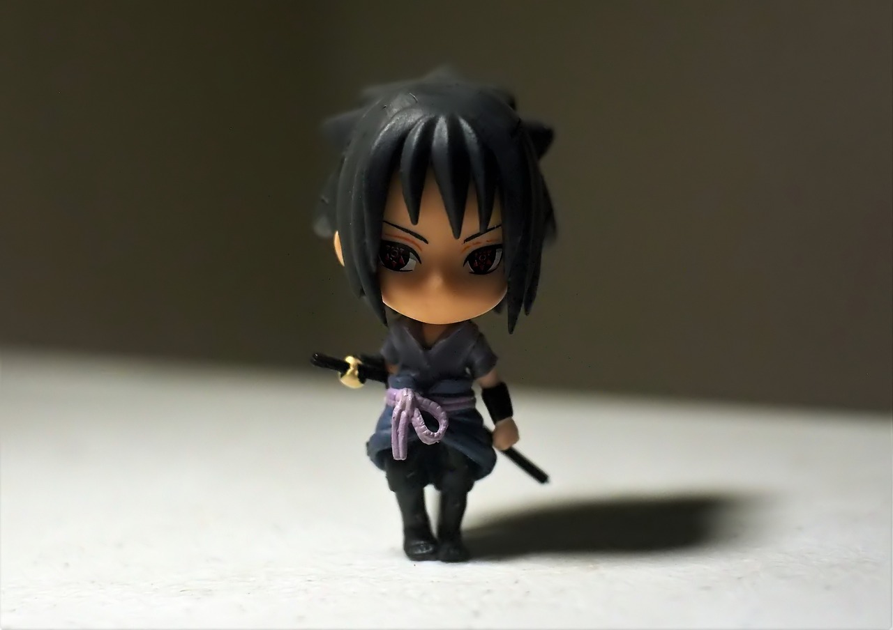 a close up of a figurine of a person with a sword, a picture, by Jin Homura, unsplash, boy has short black hair, with black pigtails, walking towards the camera, very very low quality picture