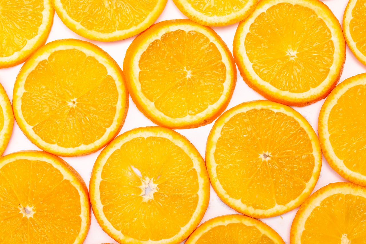 a group of orange slices sitting on top of each other, a stock photo, pexels, minimalism, background image, 🦩🪐🐞👩🏻🦳, rays of sunshine, background is white