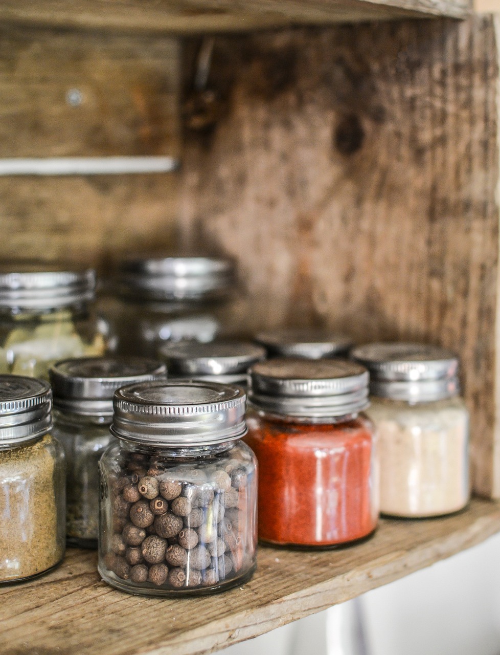 a shelf filled with lots of different types of spices, a picture, by Daniel Lieske, pexels, renaissance, glass jar, rustic wood, portrait n - 9, unfinished