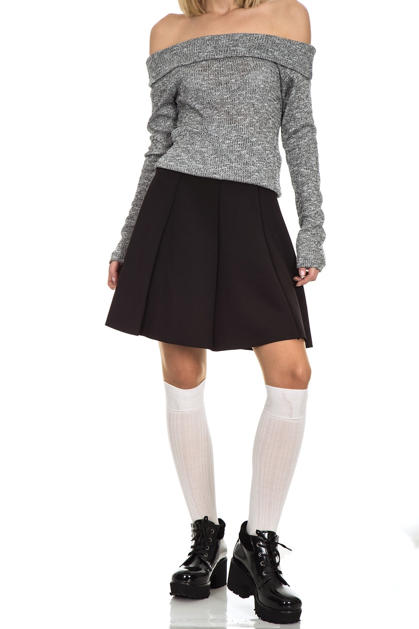 a woman in a skirt and sweater posing for a picture, shutterstock, antipodeans, gray shorts and black socks, hyperrealistic schoolgirl, minimalistic style, fullbody photo