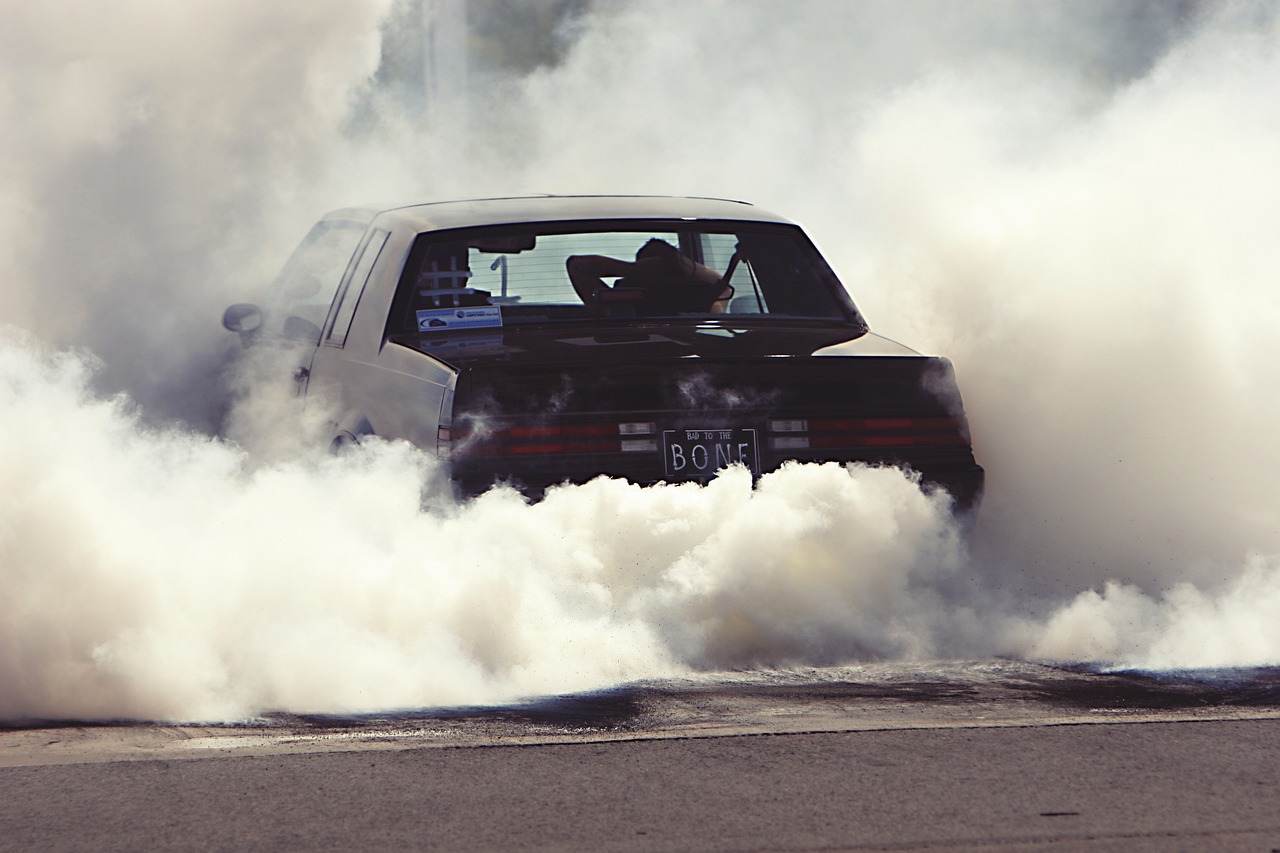 a car with a lot of smoke coming out of it, a picture, flickr, iroc, grind, colorsmoke, pipe smoke