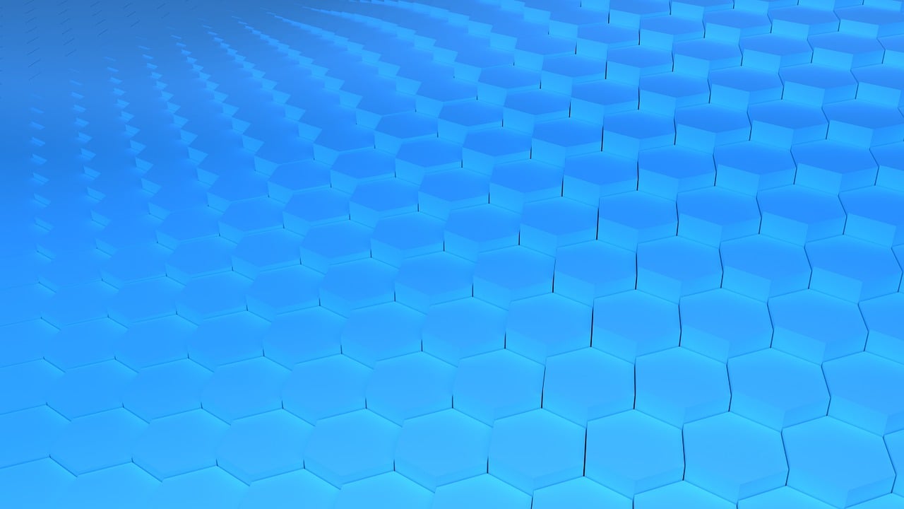 a computer keyboard sitting on top of a blue surface, a raytraced image, by Julian Allen, shutterstock, digital art, honeycomb structure, fractal pattern background, stock photo, curved perspective