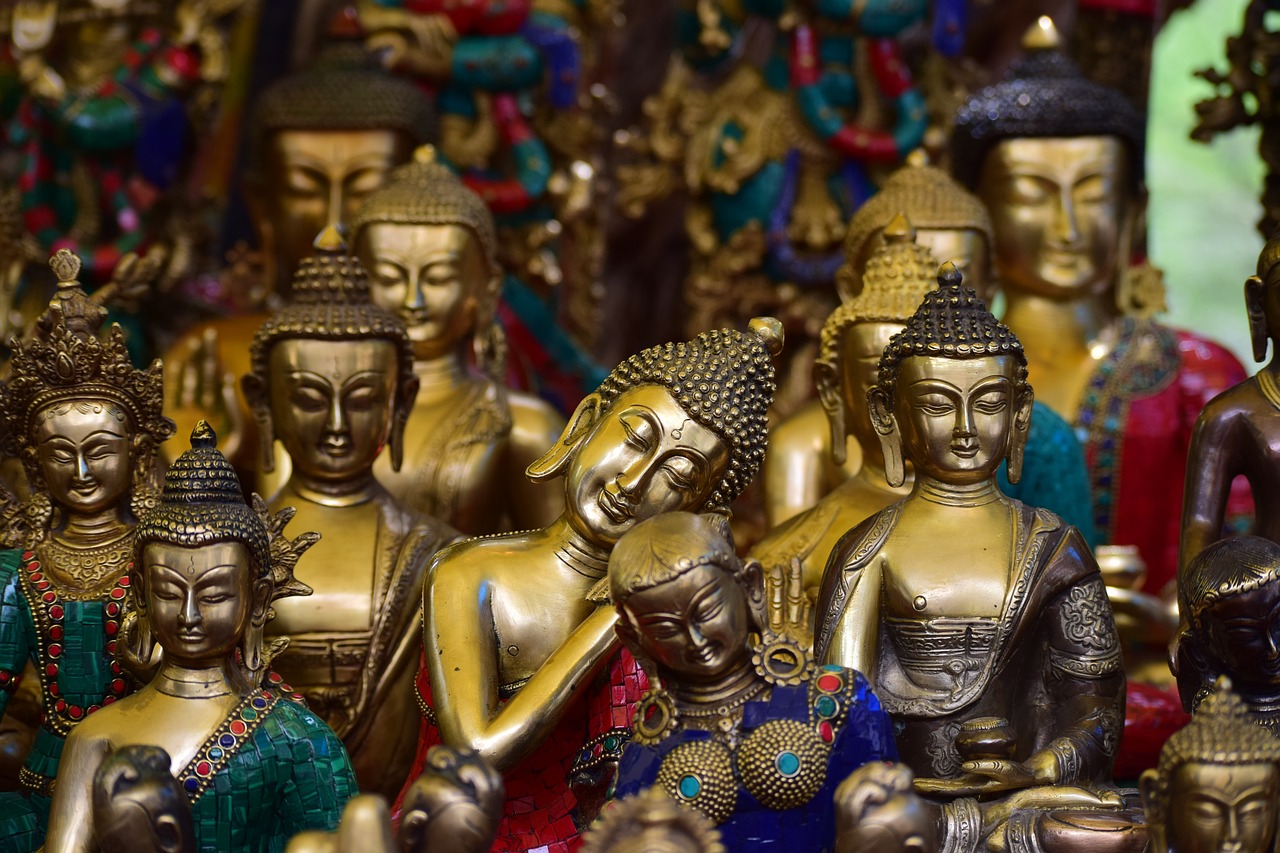 a group of gold statues sitting next to each other, trending on pixabay, cloisonnism, nepal, avatar image, full of colors and rich detail, the vibrant echoes of the market